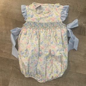 Smocked bubble with floral details and side bows from sugar plum smocks
